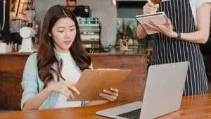 small business owner laptop notebook coffee shop